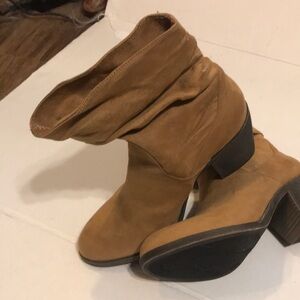 Beige ruched Boot with a stacked heel.